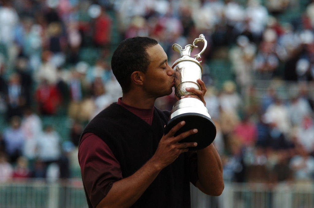 Tiger Woods kisses the Claret Jug after winning The Open in 2005